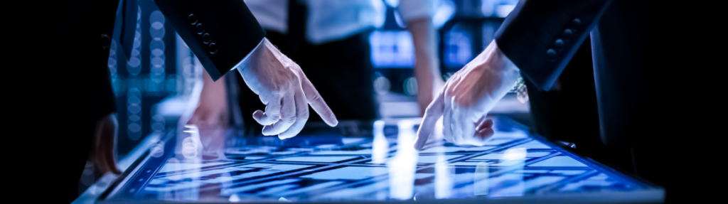 Three people working in a technology advanced environment